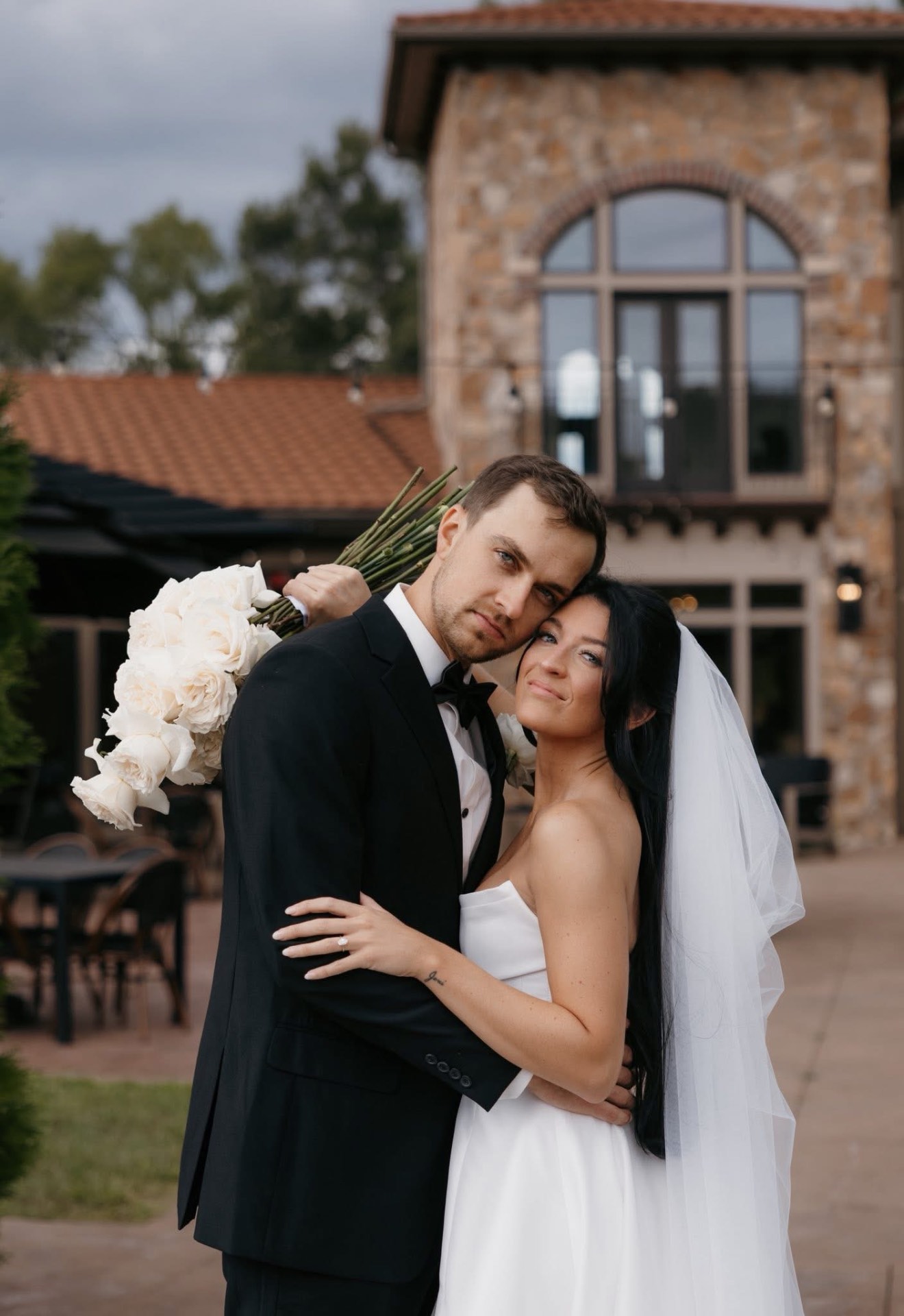 Editorial wedding tablescape with blush florals and taper candles